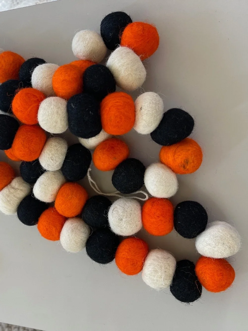 6 ft. orange, black and cream felt pom pom garland - Michael's